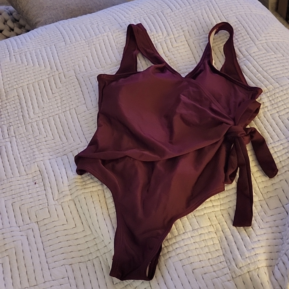 Burgundy one piece High leg cut & ties on side
